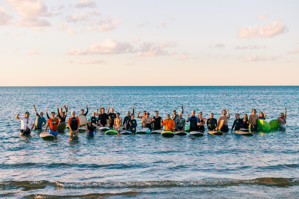 Surfrider Chicago members celebrating 17 years of legal surfing at Montrose Beach. Photo credit: Joe Siwak.
