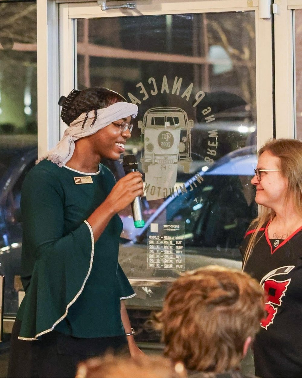 Ayanna presents an award at a Cape Fear event.
