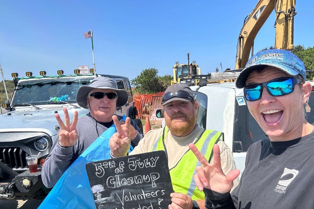 Bruce with a volunteer and Surfrider staff at a July 5 cleanup.