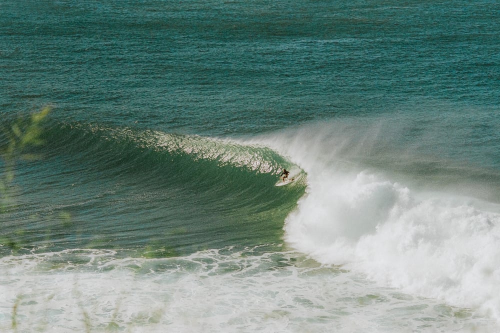 Surfer gets ready to pull into the tube on a righthand barrel at Honolua.