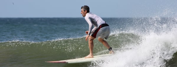 Vince rides a wave going right.