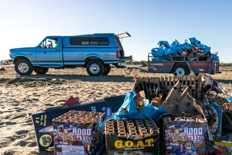 A truck and trailer loaded with firework debris following July 4.