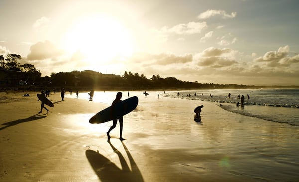 Surfer and people on the beach