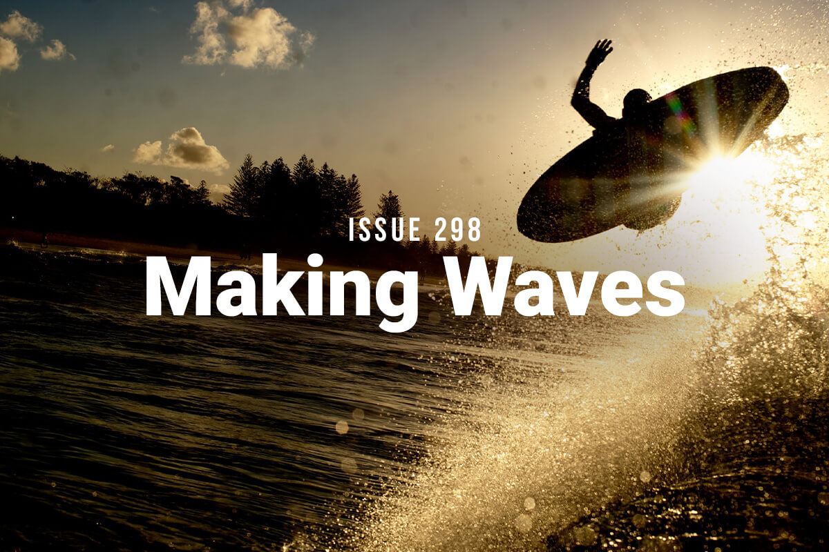Making Waves Issue 298: A silhouette of a surfer blasts an air off the lip.