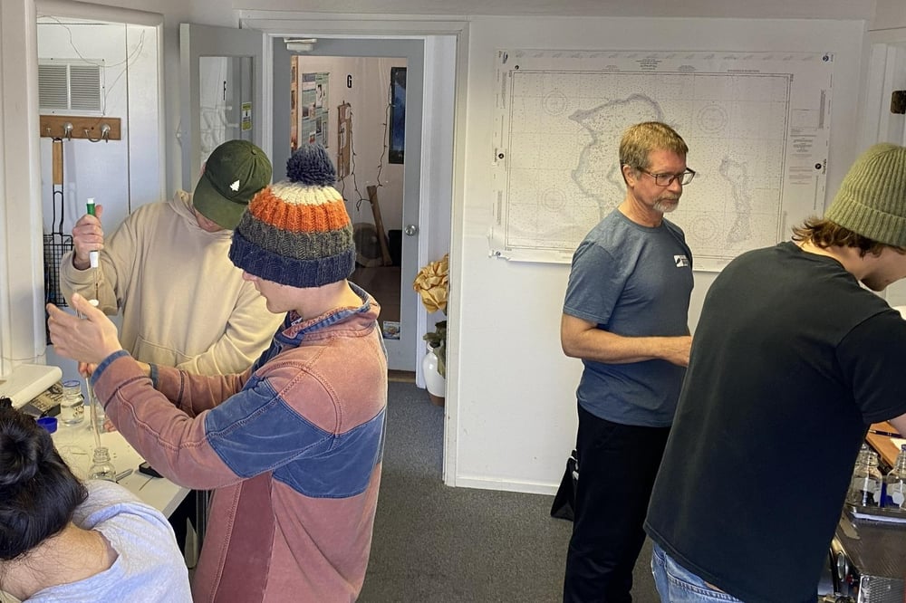 Mike works with BWTF volunteers in the alb.