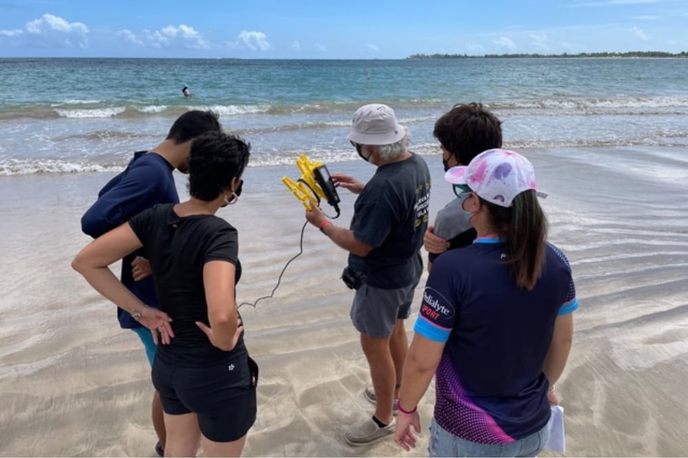 Lopez in the field with Rincón Chapter volunteers.
