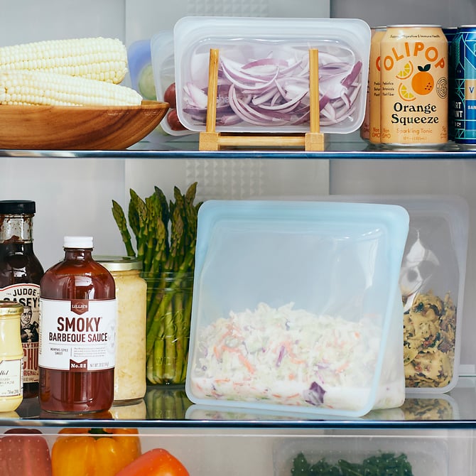 Stasher Stand Up Mega Bag with coleslaw inside in a fridge.