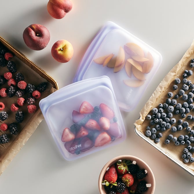Sandwich Bag with berries inside / in baking sheets around the bag