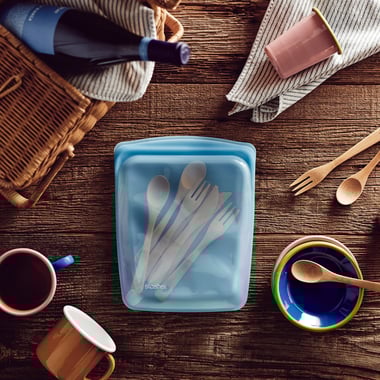 Utensils inside a blue Stasher Bag