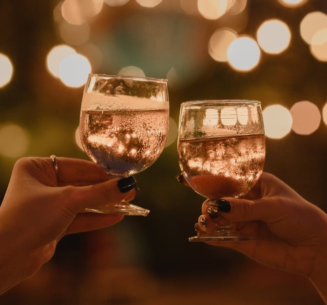 Two glasses of the Beach rosé doing a cheers