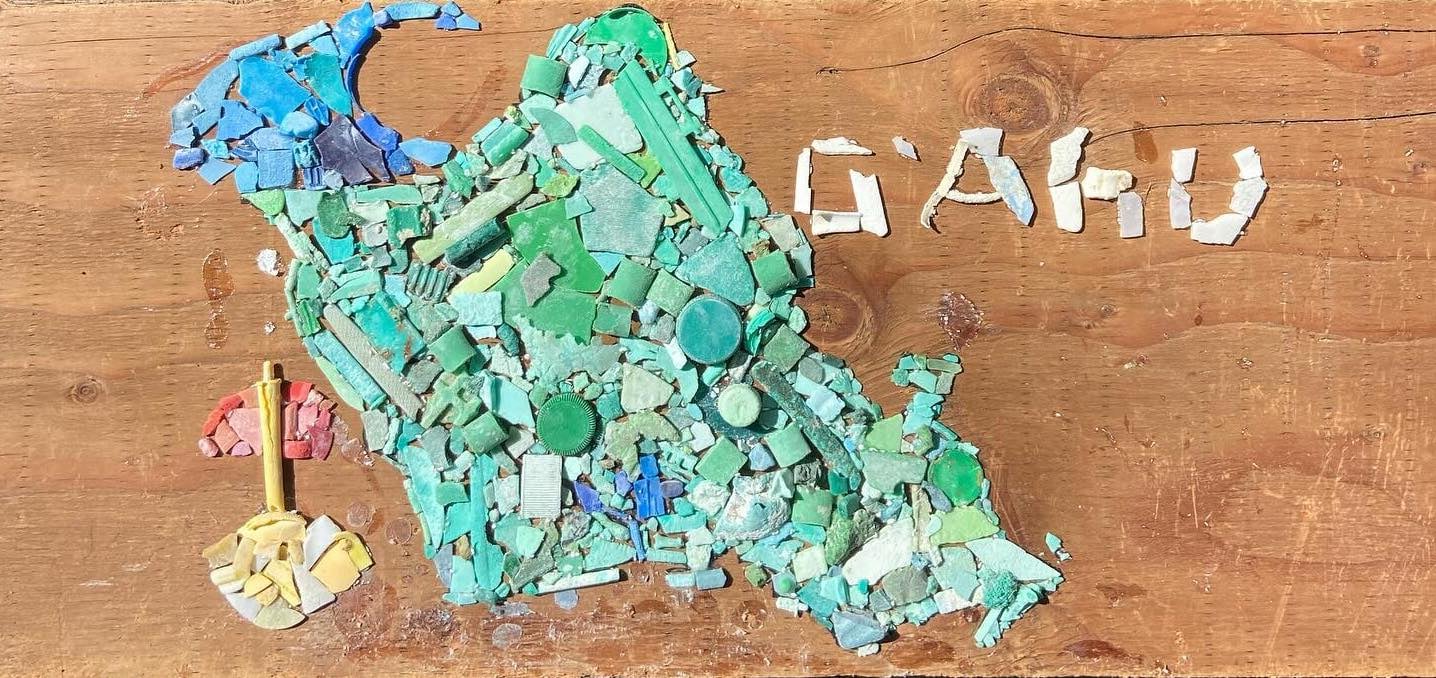 O'ahu made out of blue and green pieces of plastic trash.