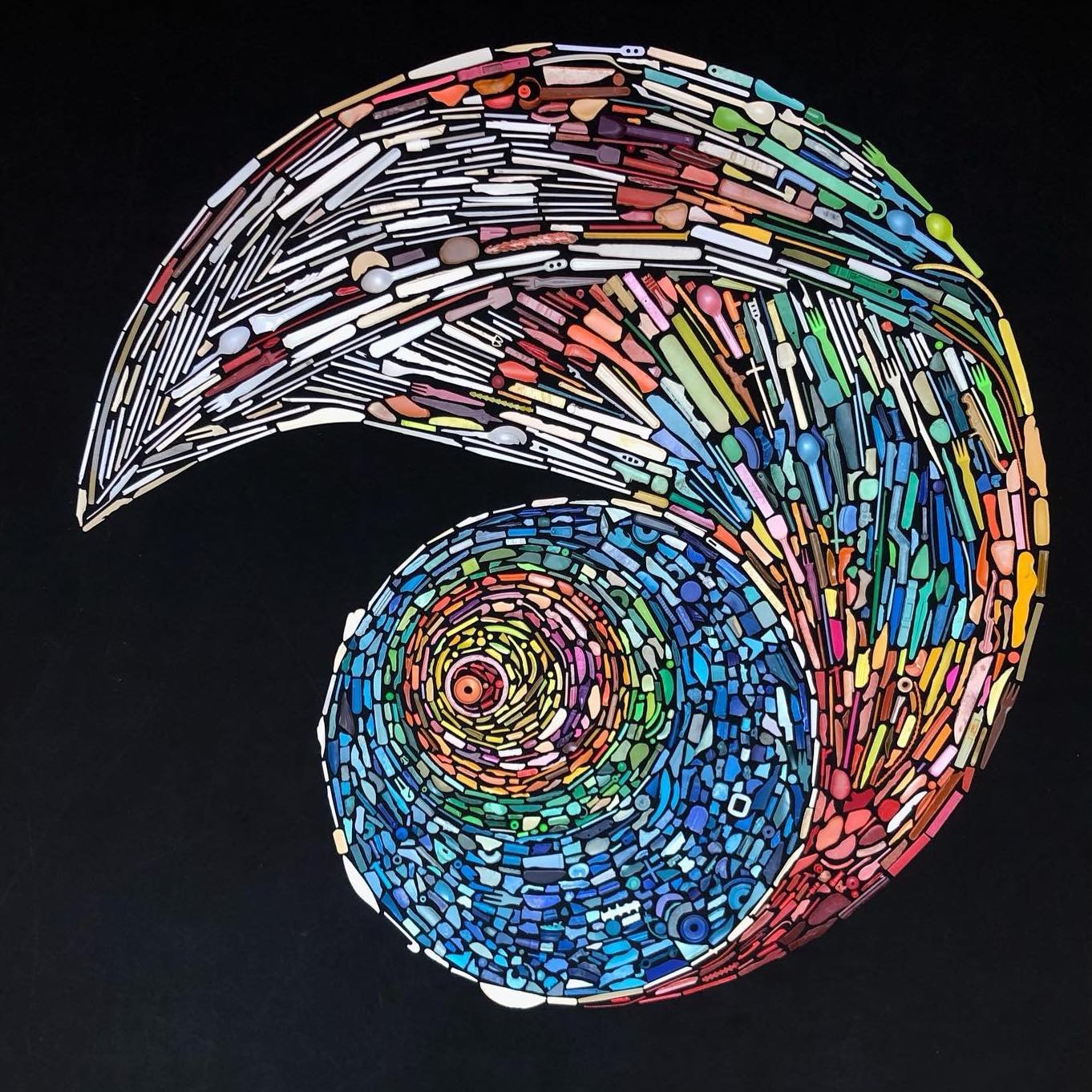 Seashell made out of colorful pieces of small plastic.