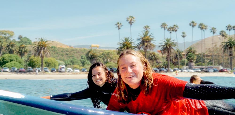 Volunteers paddle out at the Paddle Out to Protect Our Coast event at Refugio Beach in California