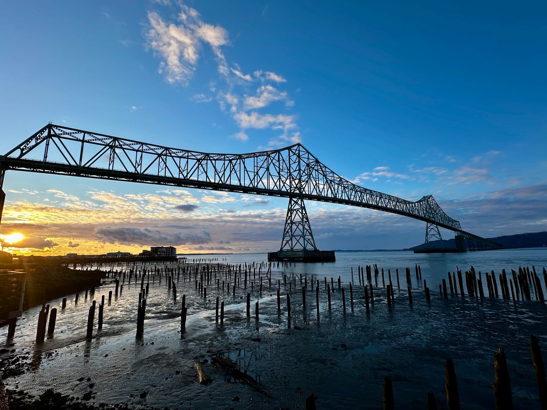A view of the Astoria Bridge at sunset