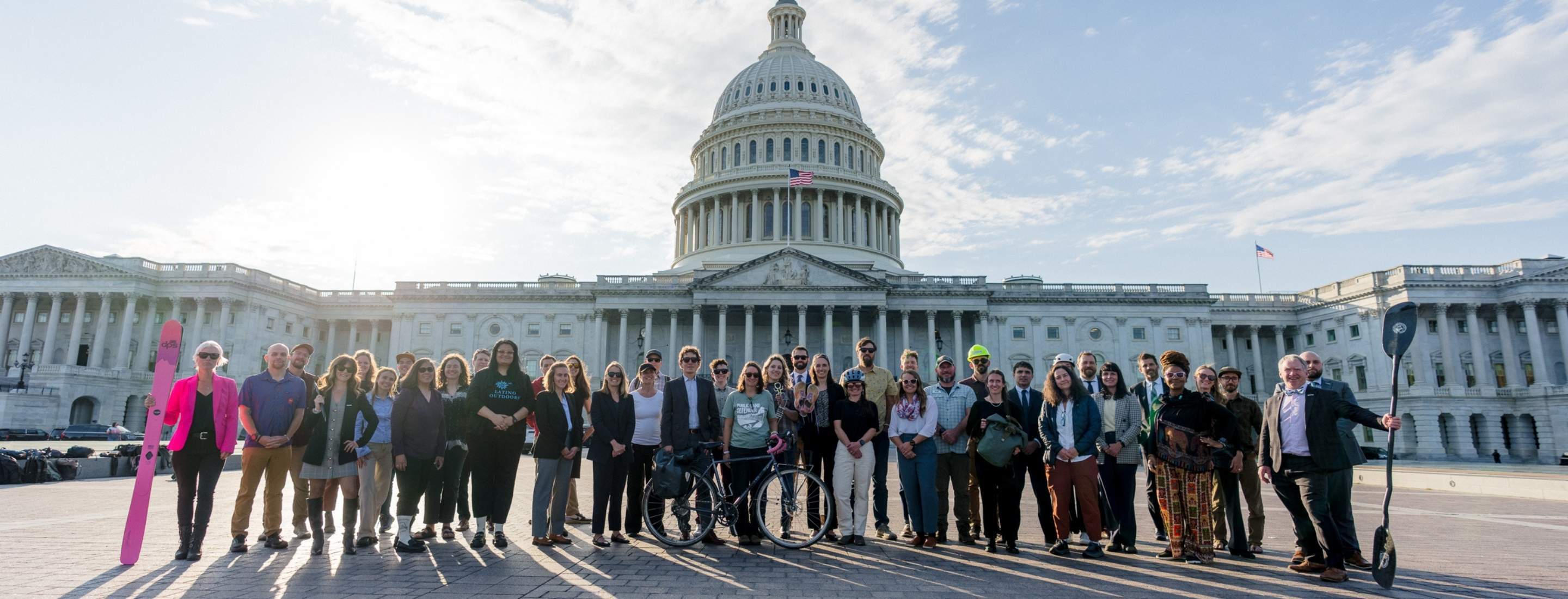 Outdoor Alliance coalition partners pose in front of the U.S. Capitol building.