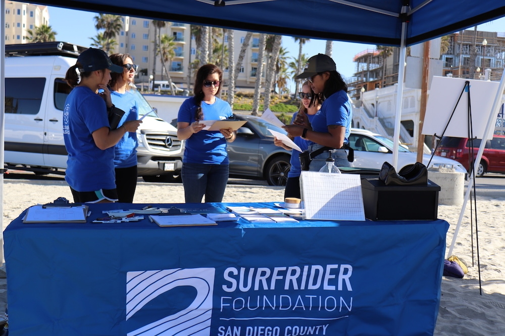 Group of volunteers at a Surfrider table Group of volunteers at a Surfrider table